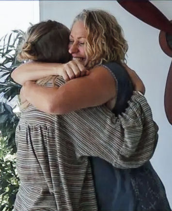 Kemina giving Tamika a hug