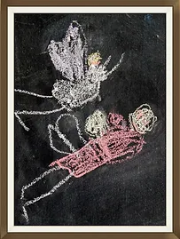 Excited over the idea of Fairy Houses, Sophie drew some on our blackboard.