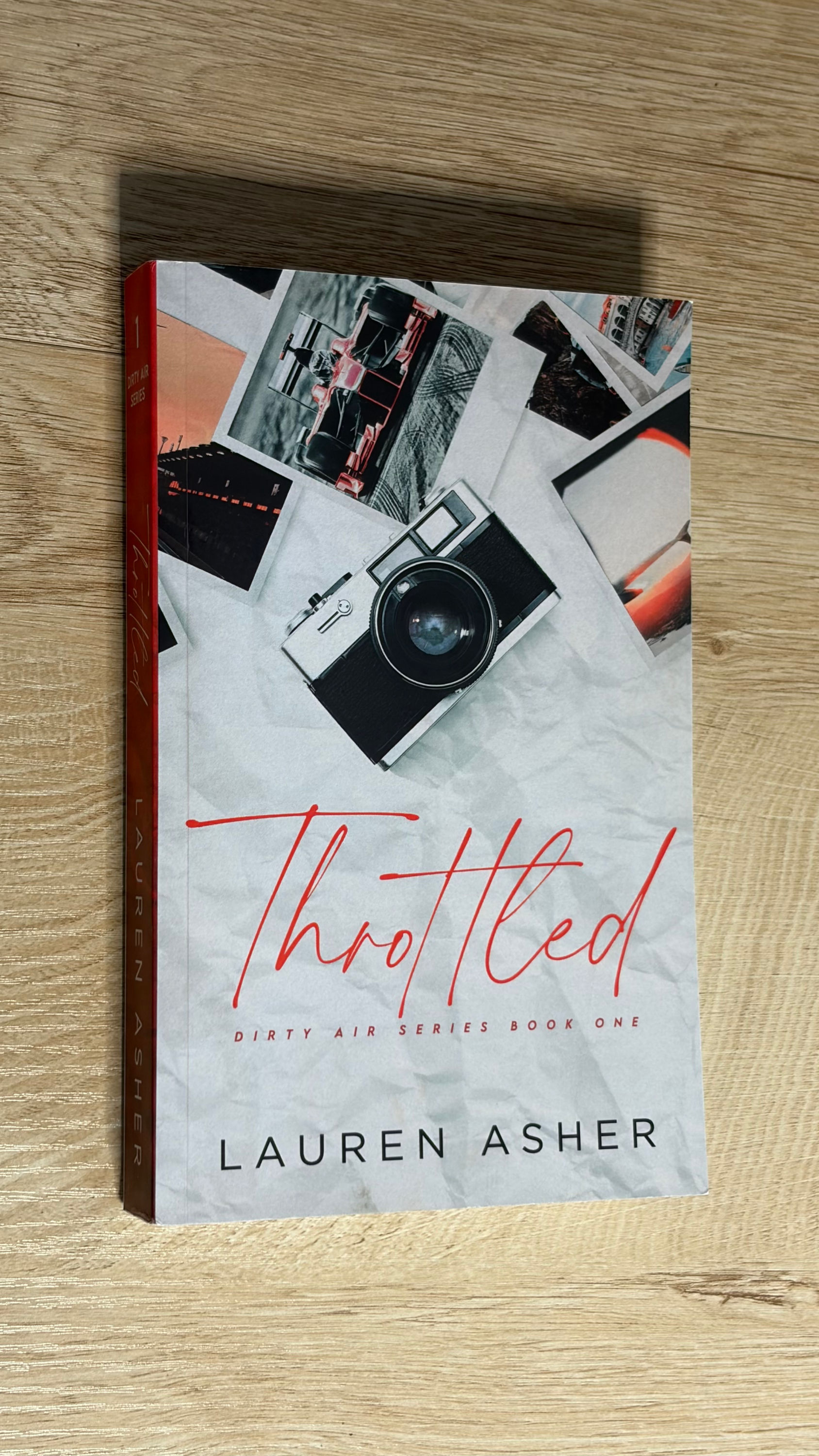 Throttled book cover featuring a vintage camera and photos