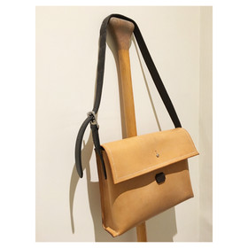 Hand stitched bag with stirrup leather strap