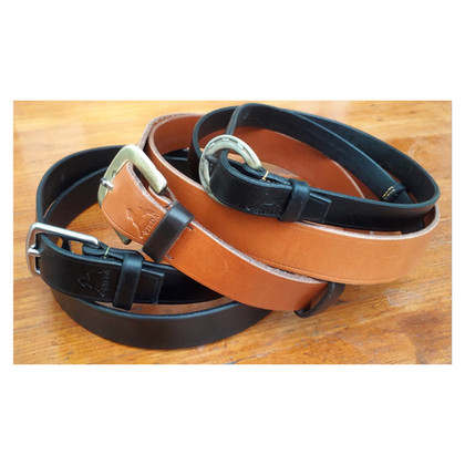 Belts with reclaimed saddlery buckles.