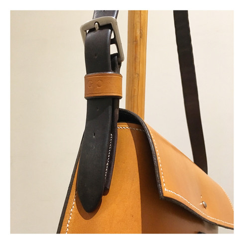 Satchel with monogrammed strap keeper