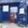 Open sign on blue shop door