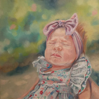 Sleeping baby in a garden setting