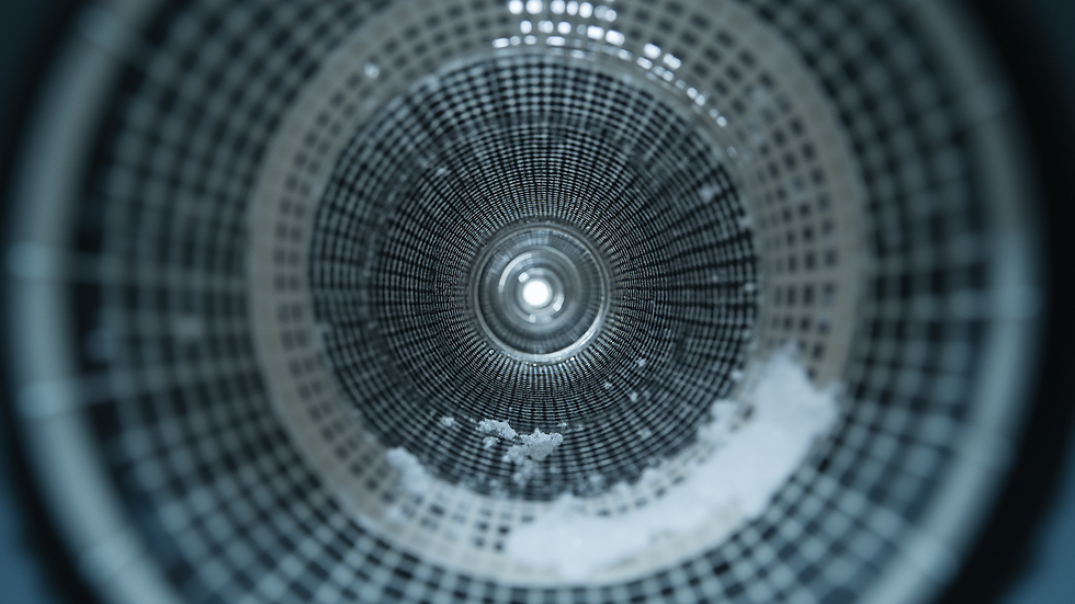 Eye-level view of dryer vent hose being cleaned