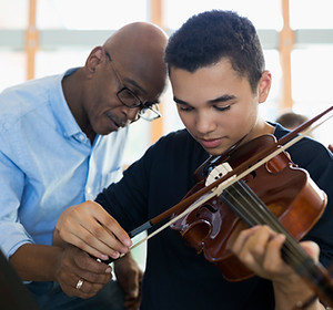 Teacher Helping Student Playing Violin