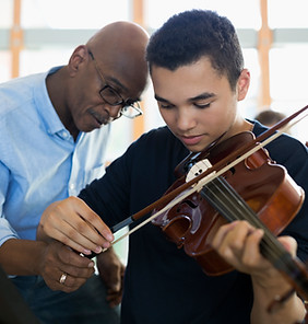 Teacher Helping Student Playing Violin