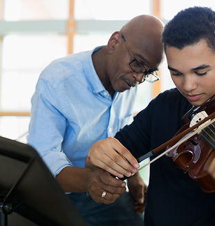 Teacher Helping Student Playing Violin