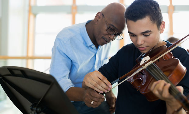 Teacher Helping Student Playing Violin