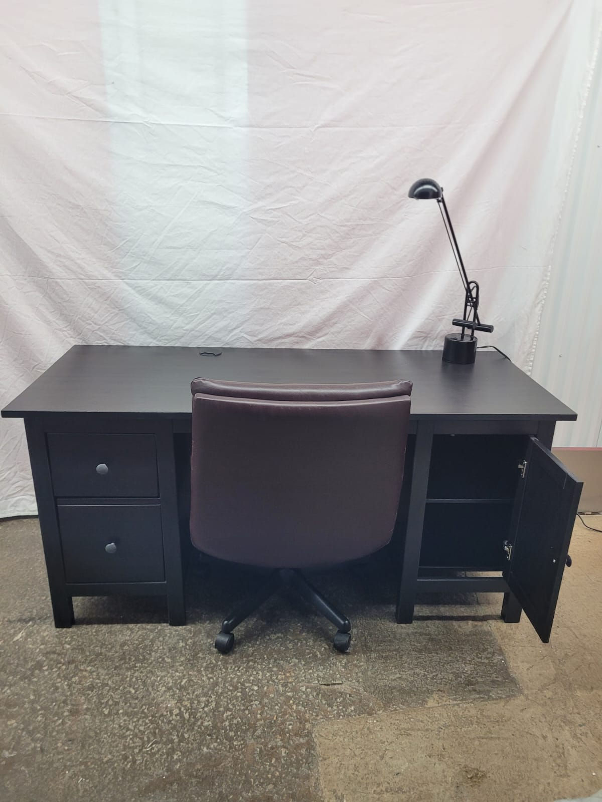 Office desk with chairs and desk lamp