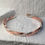 Thumbnail: Sterling And Copper Cuff Intertwined with Each Other