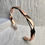 Thumbnail: Sterling And Copper Cuff Intertwined with Each Other