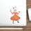 Thumbnail: die cut, water resistant sticker of a woman dressed in a burnt orange dress as "pumpkin spice" holding a latte and a pie