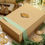 Thumbnail: Kiss-cut sticker of a s'mores dessert with graham crackers, chocolate, and marshmallows on a box. Sticker is non waterproof