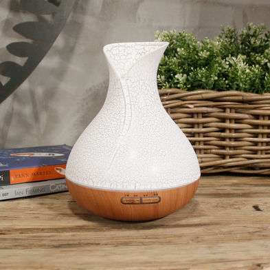 Exclusive large palma air diffuser in a leaf wrap marble white design with pine coloured base