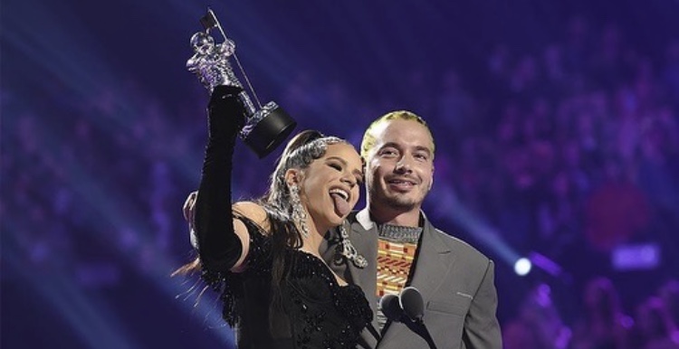 "Con Altura," a collaboration between Rosalía, J Balvin, and Spanish producer Pablo Díaz-Reixa Díaz, better known as El Guincho, was released on March 28, 2019. The music video, which won two MTV Video Music Awards for Best Latin and Best Choreography making her the first Spanish winning-artist at the ceremony, was directed by Director X, accompanied its release the same day. The song debuted at number one in Spain. Billboard ranked it 5th on their list of 100 Best Songs of 2019. 