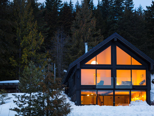Snow-covered hillside custom home at Alta Lake in Whistler, BC