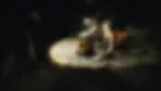 Sent Into Space recovery team retrieving a Samsonite Proxis case in the dark in the Nevada Desert with a torch illuminating the case