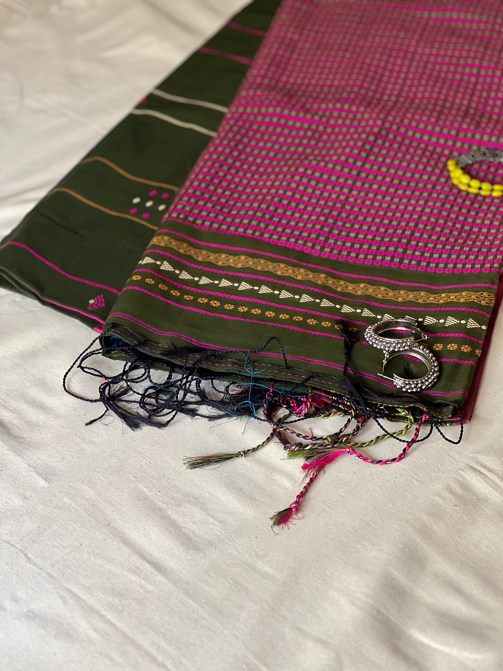 Green Begumpuri khadi cotton saree with pink and white buttas.