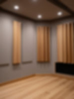 Wooden acoustic diffusers in a recording studio.