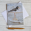 Thumbnail: oystercatcher art greetings card, standing in shallow water, viewed from above with white envelope