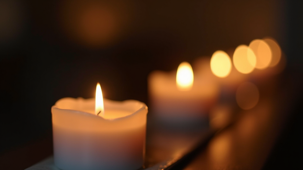 Close-up view of a softly lit candle with a calming flame