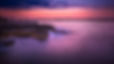 rocks_sea_coast_and_landscape_view_of_buildings_under_purple_sky_during_sunset_4k_hd_natur