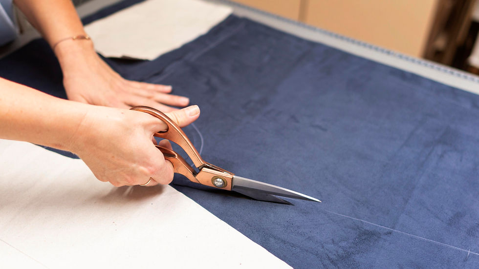 hands-cutting-material-with-scissors-close-up.jpg