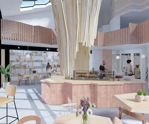 Bar du café central avec sculpture bois et carrelage naturel mural claustra et boutique d'objet anciesn en second plan