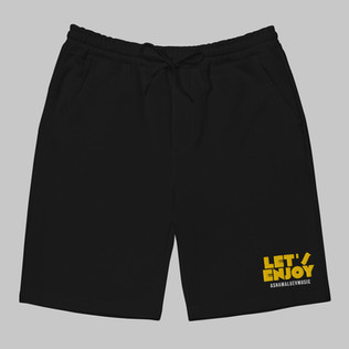 Black men's shorts with yellow text 'Let's Enjoy' and 'ASHAMALUEVMUSIC' on a gray background
