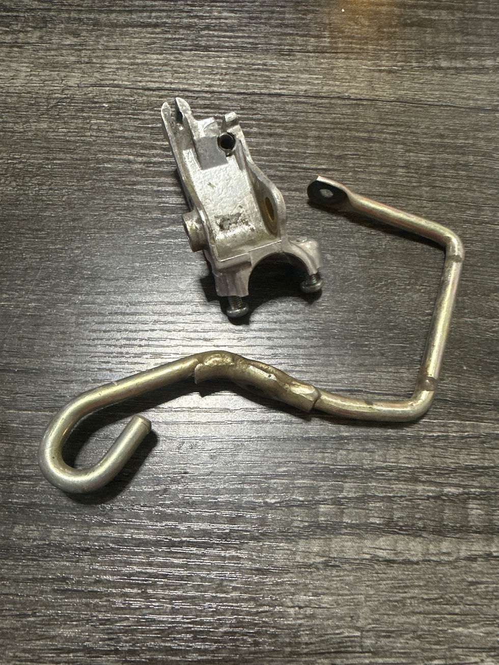 TRX125 LEVER BRACKET & SEAT LATCH LEVER