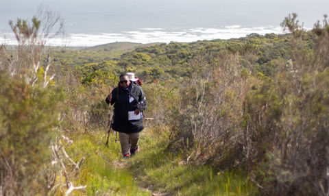 Walking with the ocean in the background