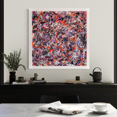 Large square abstract painting dominated by red, magenta, black and white swirling patterns hanging on a modern dining room wall above a black sideboard with various items on it