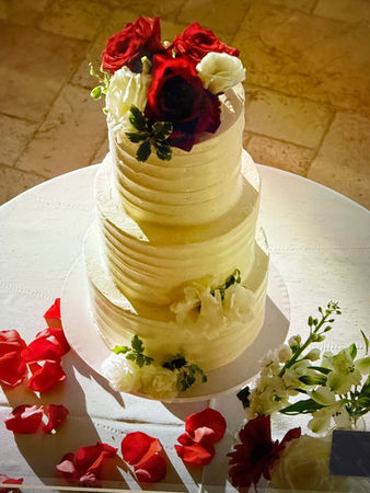 3 tiered ivory wedding cake- red, burgundy flowers
