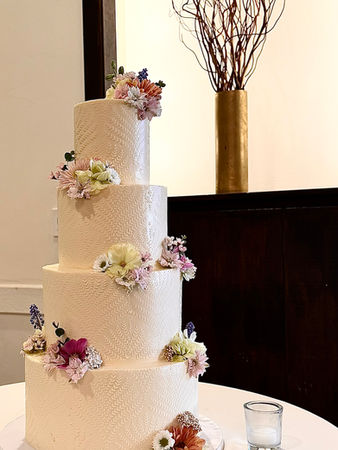 4 tier- stenciled-wedding cake-ivory with flowers