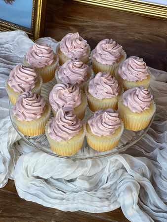 standard cupcakes with pink swirl tops