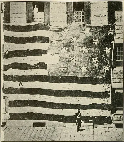 An 1878 photograph of the original Fort McHenry flag. Image courtesy of WikiCommons.