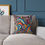 Thumbnail: Colorful paisley patterned throw pillow on couch