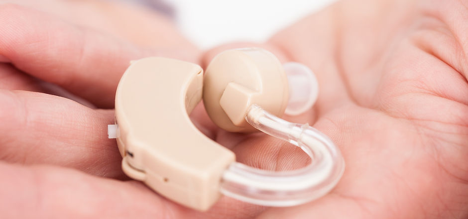 Close-up Of A Hearing Aid On Person's Pa
