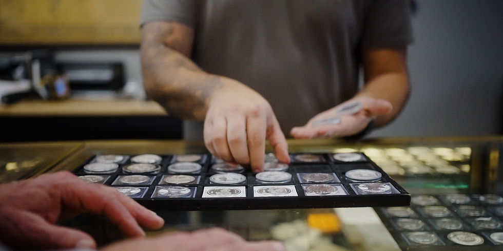 Jesse Picking up coins with previous shop owner.jpg