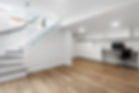 Recently restored and Remodeled basement with wooden floor and white painted walls