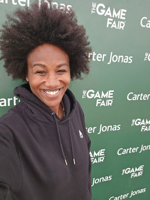 Author Nicole Moore aka shooting girl with an afro at the game fair 2026 official ambassador