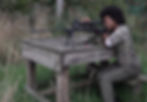 Shooting girl with an afro zeroing rifle hikmicro scope fieldsports tv