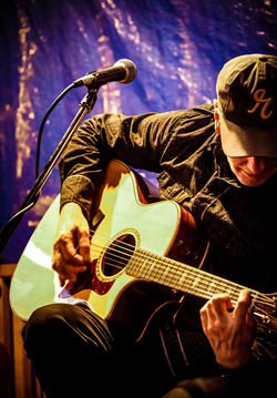 John playing guitar