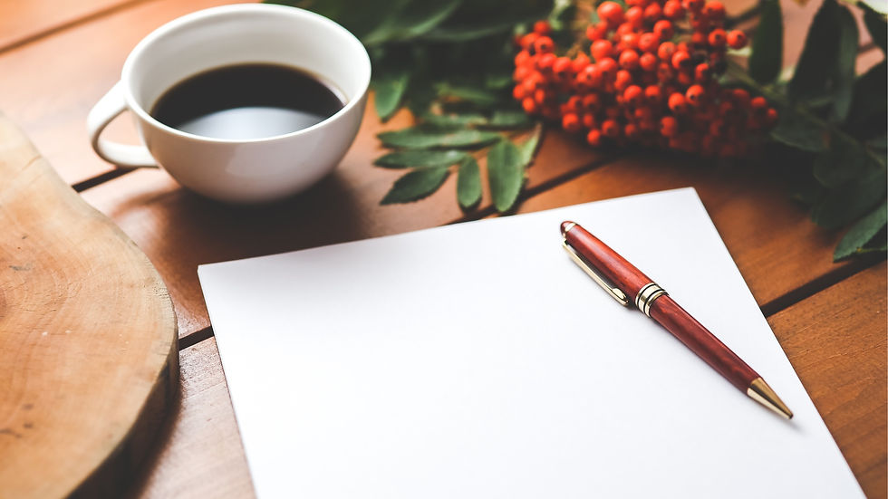 coffee cup, writing pad and pen