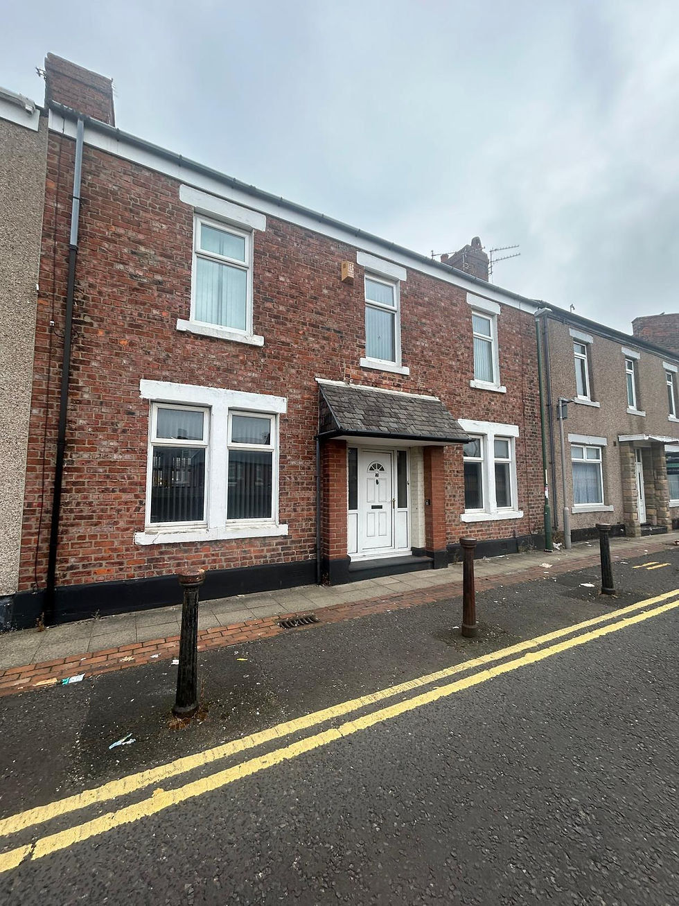 A red-brick terraced house on a North East street, photographed by our local partner on a viewing
