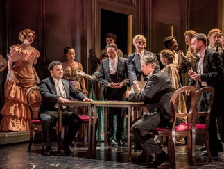 Frances Gregory (Flora Bervoix), Tigran Melkonyan (Alfredo Germont) and chorus in La Traviata at Buxton International Festival Credit Genevieve Girling