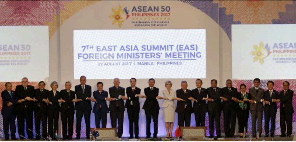 Foreign ministers from Southeast Asia and their dialogue partners link arms during the group photo at the start of the 7th East Asia Summit Foreign Ministers' Meeting and its dialogue partners as part of the 50th Association of Southeast Asian Nations (ASEAN) regional security forum in Manila on August 7, 2017. (Photo by Aaron Favila)