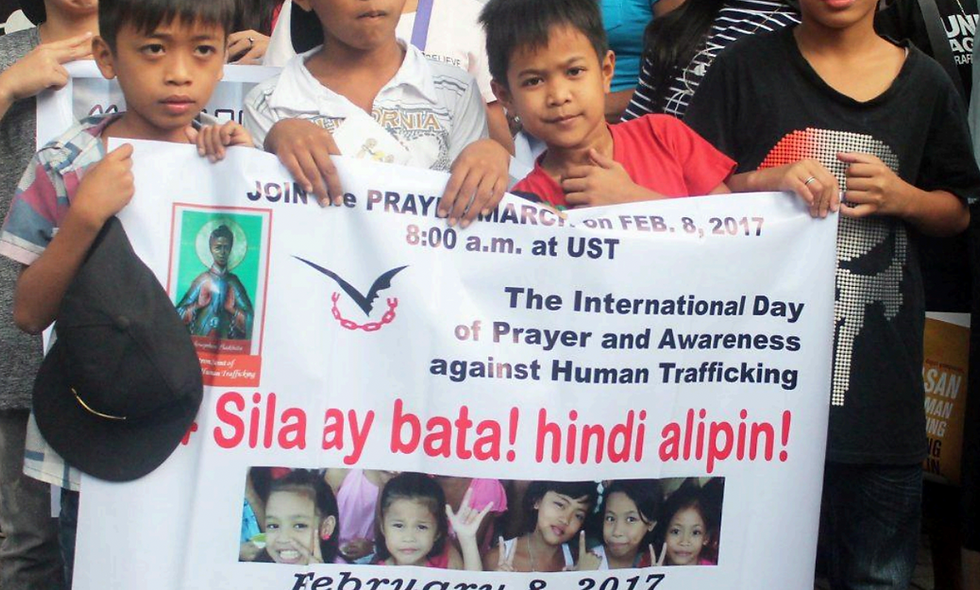 Photo of Filipino children in a Prayer-March against Human Trafficking, on February 8, 2017 (Photo by University of Santo Tomas)