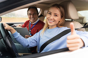 woman-male-driving-instructor-driving-test.jpg